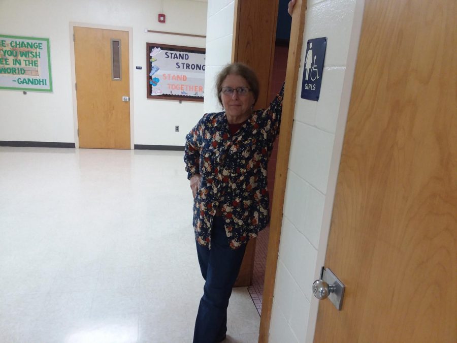 English Teacher Ms. Barter hanging out of the girls bathroom.