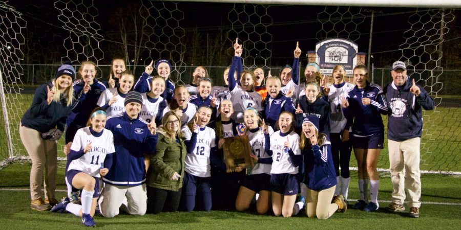 The Girls Varsity Soccer team celebrates finally claiming the Northern Maine Regional Championship trophy in a 1-0 win over longtime rival Hermon Hawks.