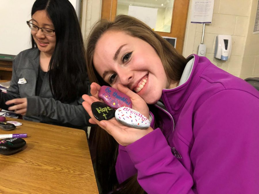 Gabrielle Jandreau 18 shows off her painted rocks