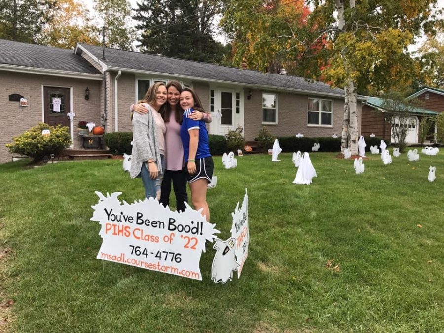 Class President Madison Hedrich, Vice President Libby Kinney, and Class Adviser LeRae Kinney stand in front of a house thats been bood.  “I think that this is a very good fundraiser to start our year off with!” said Hedrich. Boo your neighbor will be going on until the end of October.