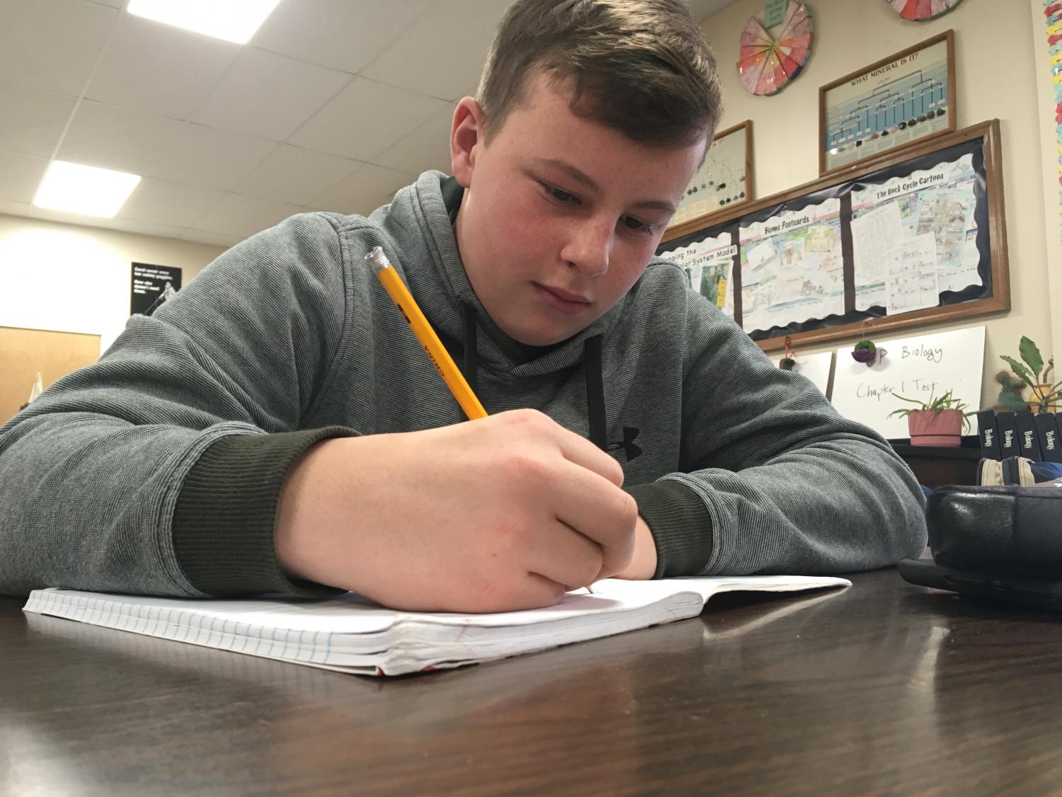 Hunter Stubbs ‘21 catches up on French homework during his afternoon study hall.Students arrived at 11:20 A.M. Friday morning.