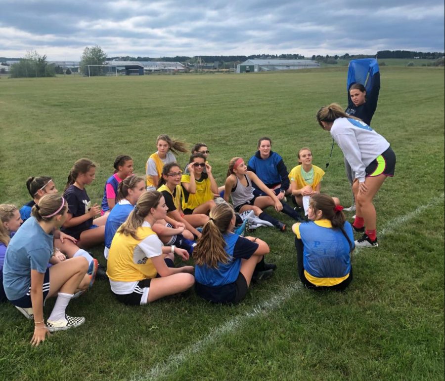 JV soccer coach Delaney Williams stands in front of her team at practice on September 4. “I love kids, and I love soccer. Coaching soccer here is all of that and more,” she said.