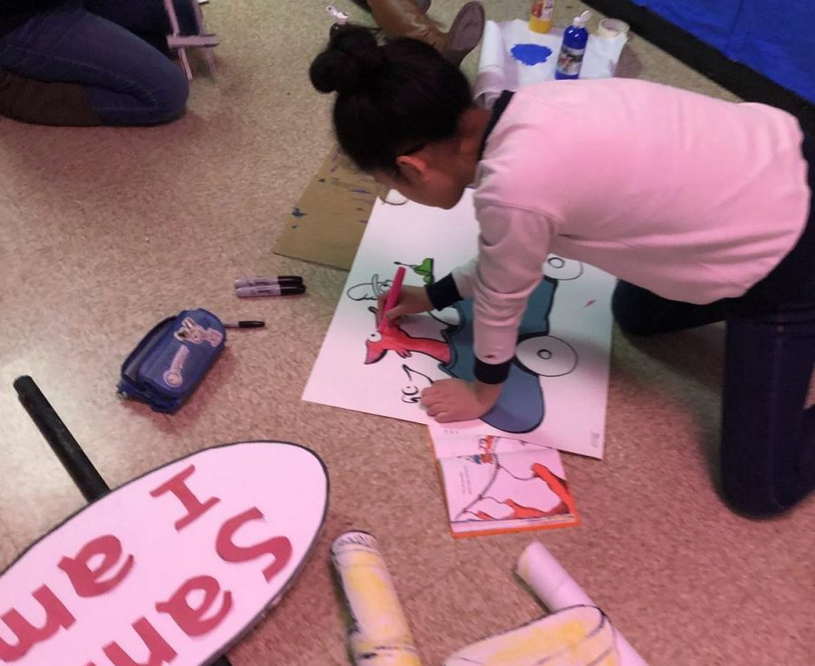 Joy Wang 20 decorates for her Dr. Seuss themed hall during Deck the Halls in November 2019.