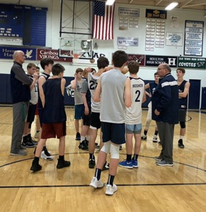 JV Coach Bill Guerrette works with assistant coach Dave Whitaker during practice early in the season. Whitaker was transitioned to the assistant coach for the JV team after his team was Eliminated due to low numbers.