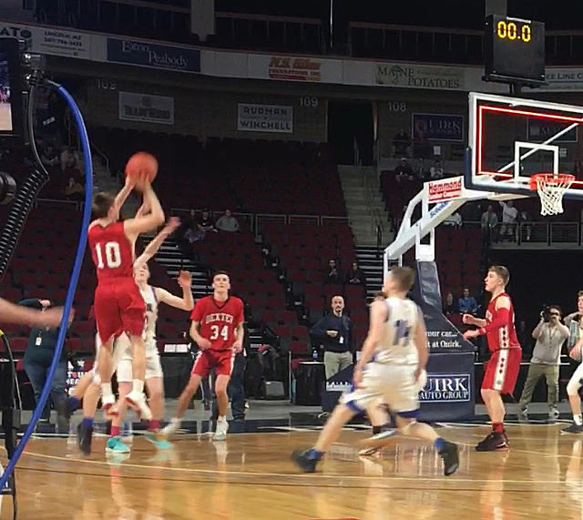 Parker Ponte shoots the game-winning shot in the Class C Boys Regional Final against Central Aroostook as the clock shows zero.