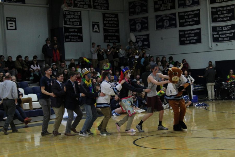 The juniors begin a conga line out on the gym floor..