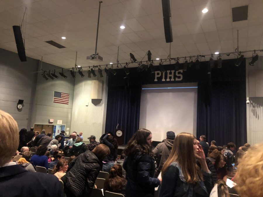 Athletes, coaches, and parents prepare to leave the auditorium following the conclusion of the Winter Sports Awards presentation on March 9, 2020.