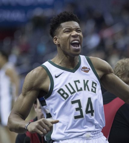 Giannis shows his energy after an exciting play. He recently signed a record breaking contract with the Bucks. 