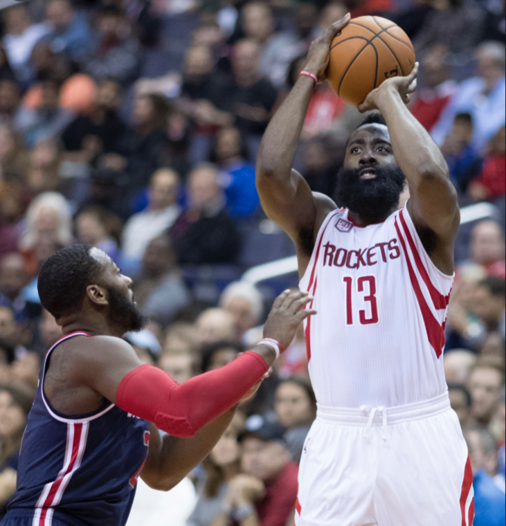 Harden shoots a difficult shot over a defender. Harden has announced he is open to trade.