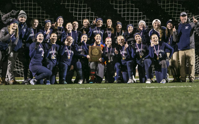 The varsity girls soccer team celebrates the 2018 Class B North regional title victory.