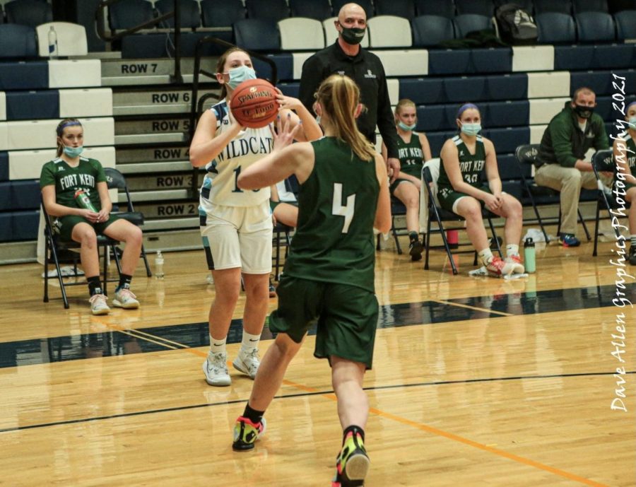 Hattie Bubar (10) attempts a three point shot during a February 2021 meeting with the Fort Kent Warriors at Presque Isle High School.
