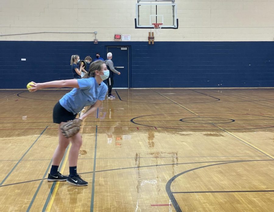 Senior Hattie Bubar winds up to pitch during Monday’s opening softball practice at Presque Isle High School.