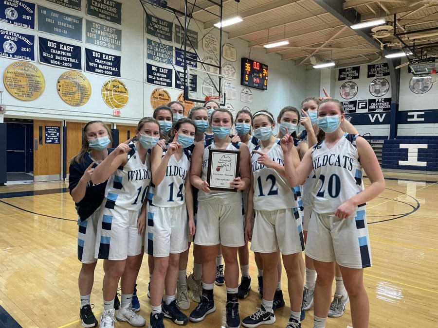 The+13+members+of+the+Presque+Isle+girls+varsity+basketball+team+celebrate+with+the+plaque+after+their+Aroostook+League+Championship+win+on+Monday.