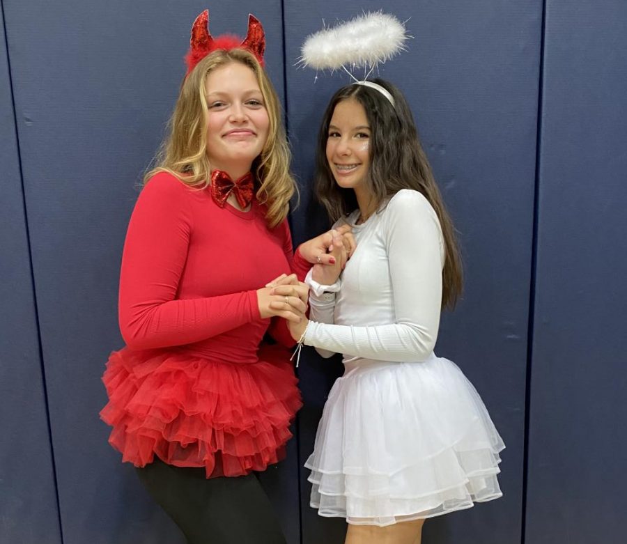 Freshmen Kacie Marston and Abigail Collins dress as the Devil and Angel for school dress up day