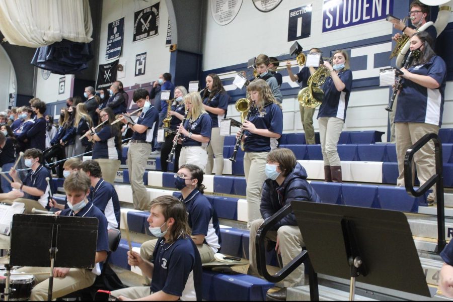 The PIHS band plays during warmups of the girls varsity basketball game, Presque Isle against Caribou. Band members are required to sit three feet apart at all times and wear masks when not playing. “Mr Priest is the best! said Demetrius Ortiz 25.