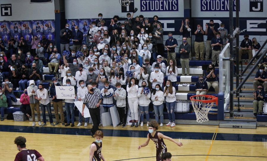 The PIHS student section cheers loudly after Presque Isle varsity boys players scores during the big rival game on Wednesday, January 5. I wouldnt say Im a leader of the student section, said Ethan Shaw 22. Im just the loudest and everyone listens to me. Which is pretty epic.