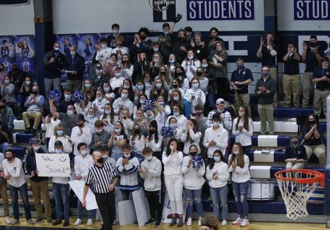 The PIHS student section cheers loudly after Presque Isle varsity boys players scores during the big rival game on Wednesday, January 5. I wouldnt say Im a leader of the student section, said Ethan Shaw 22. Im just the loudest and everyone listens to me. Which is pretty epic.