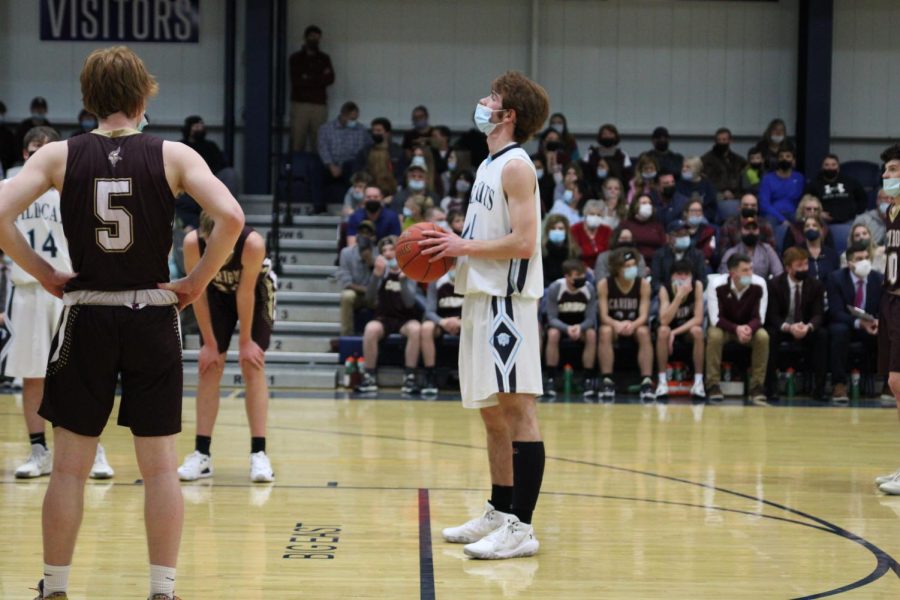 Jack Hallett 23’ lines up in concentration ready to take one his foul shots. Hallett shot five for five from the free throw line to help lead the team to victory with a 41 to 57 win over the Caribou Vikings on Wednesday, January 5.