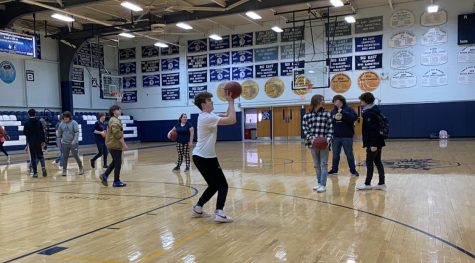 On the first day of masks being optional on March 1, students take full advantage of this time by playing basketball in the gym before school without face coverings.