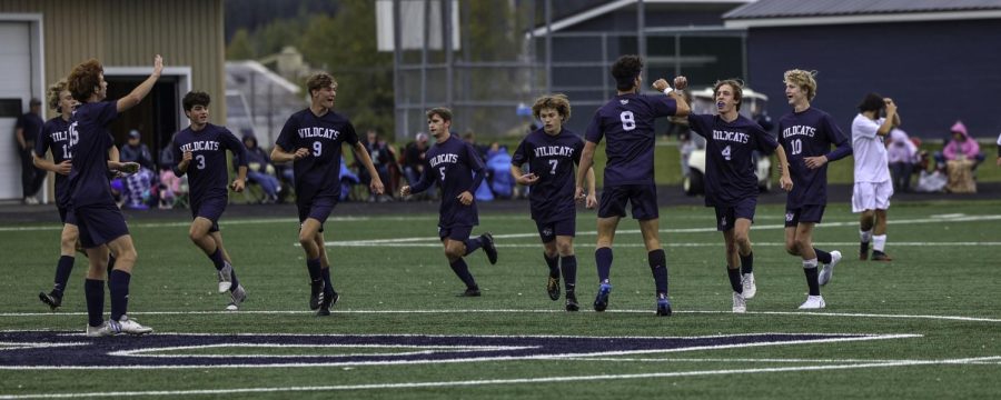 Members of the boys soccer team celebrate after a first half goal against Ellsworth on October 1.