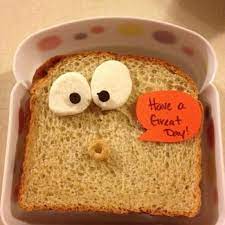 A piece of bread sending the message to have a great day on the weekly quiz about school lunch options.