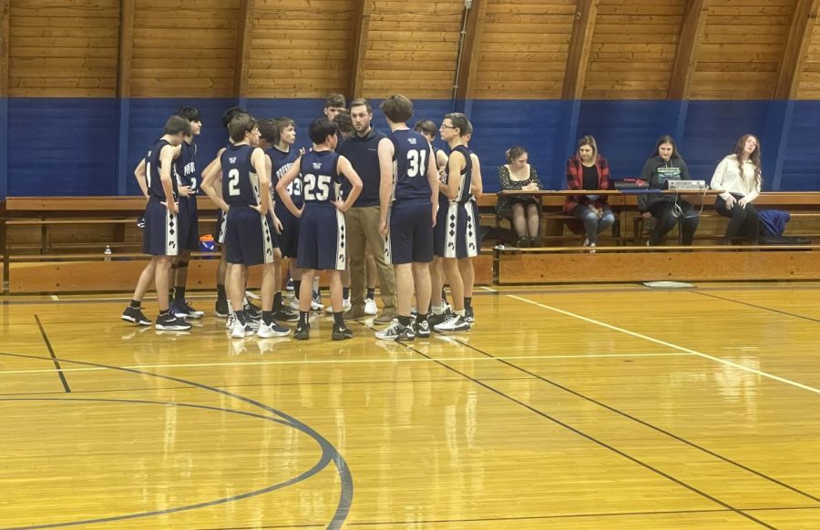 JV boys huddle during the third quarter in their game at Easton on November 29.  The team came away with an easy win.