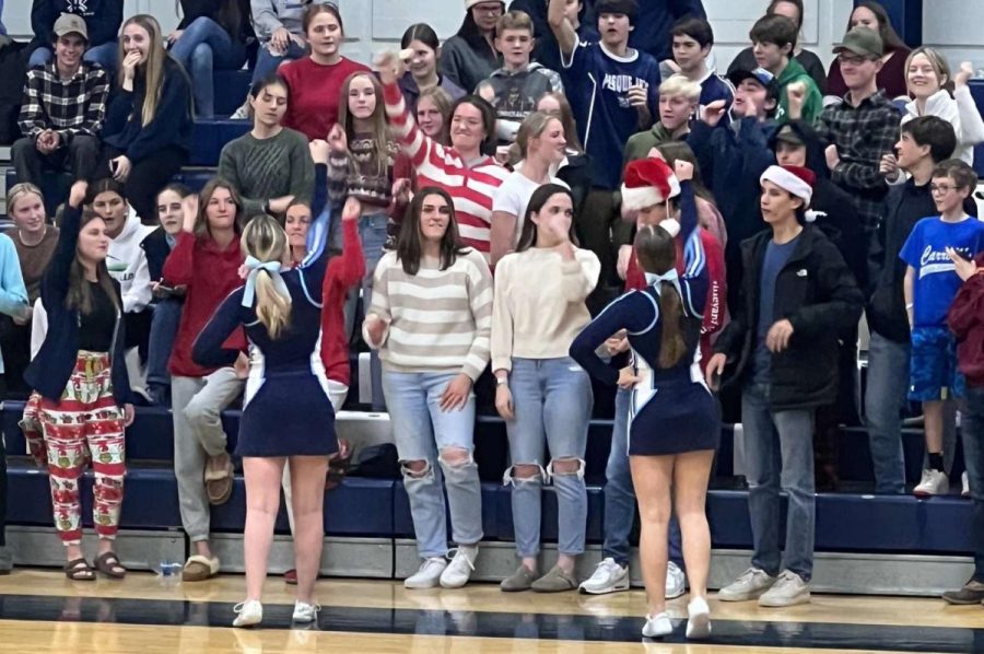 On+December+14%2C+PIHS+students+cheer+on+the+varsity+boys+basketball+team+as+they+play+Old+Town.+The+theme+was+Candy+Cane.