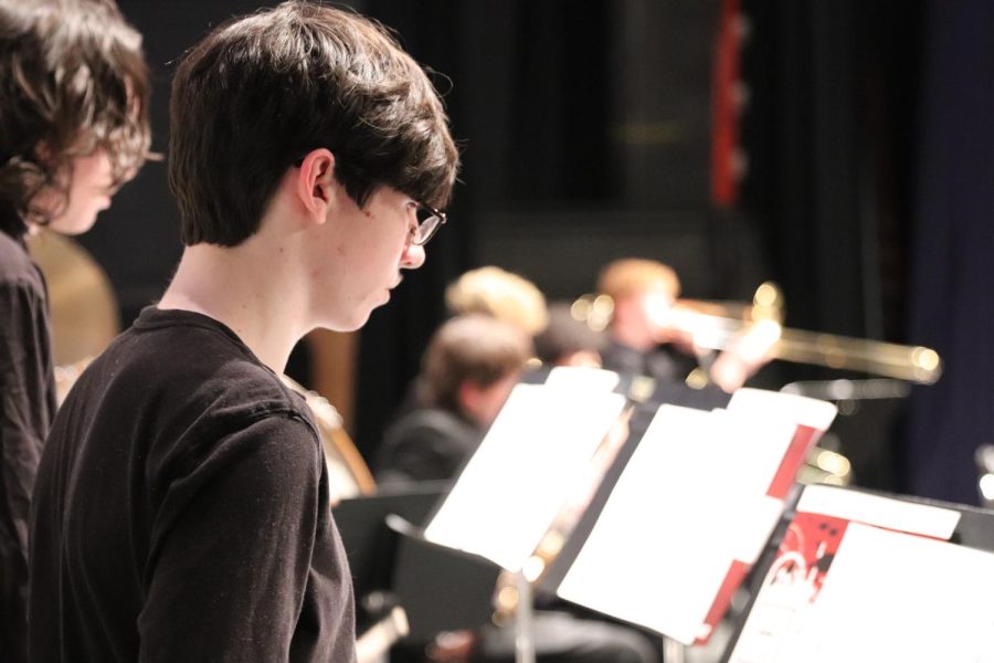 Trey Newcomb 24 watches for his cue on the xylophone at the winter concert on December 15.
