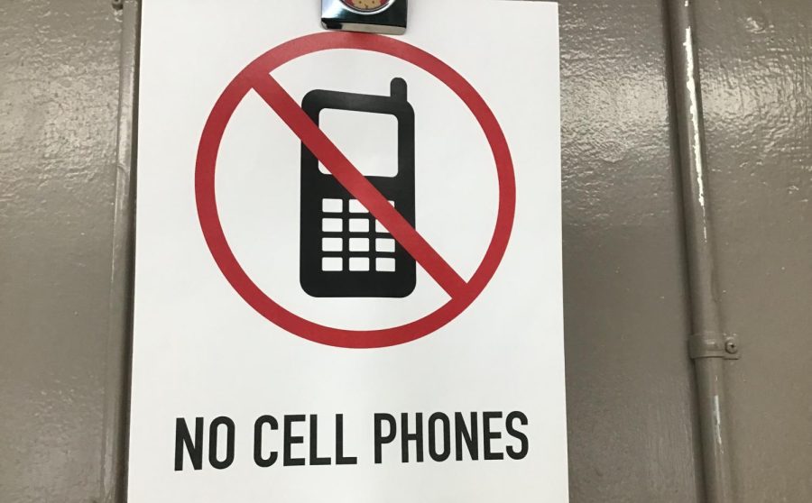 A picture of one of the many no cell phone signs scattered across the school.