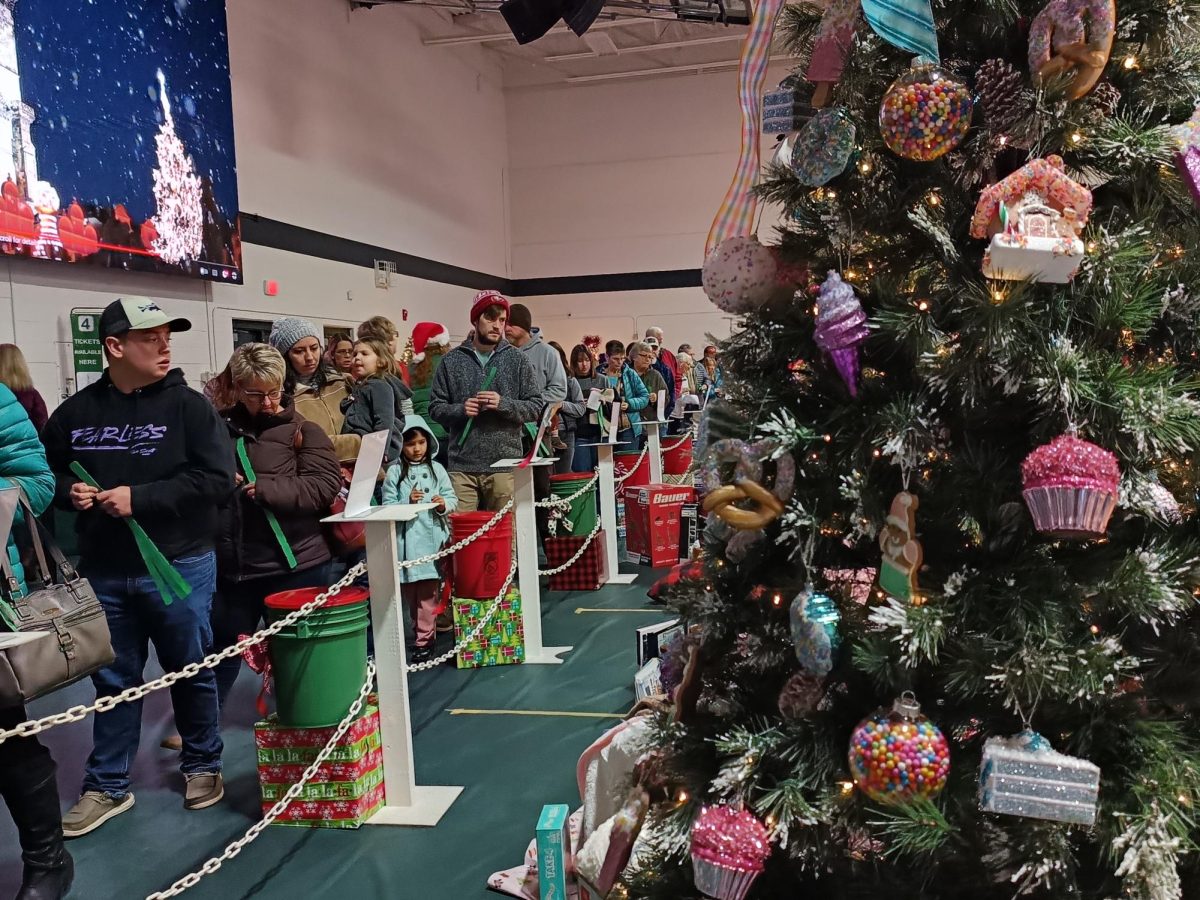 Visitors from everywhere waited anxiously in line to drop raffle tickets in buckets to attempt to win their favorite trees.
