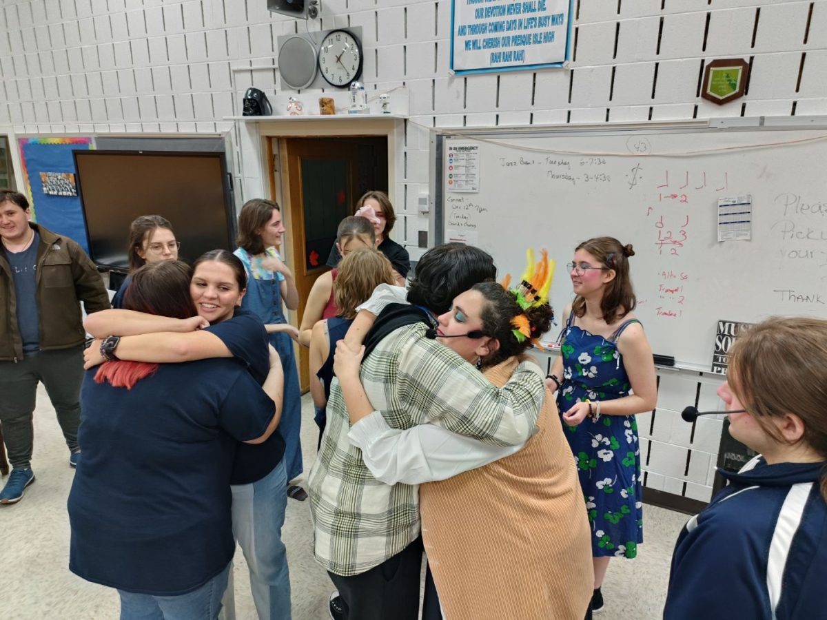 The cast and crew hug one last time before their final showing of “High school musical” on November 19.
