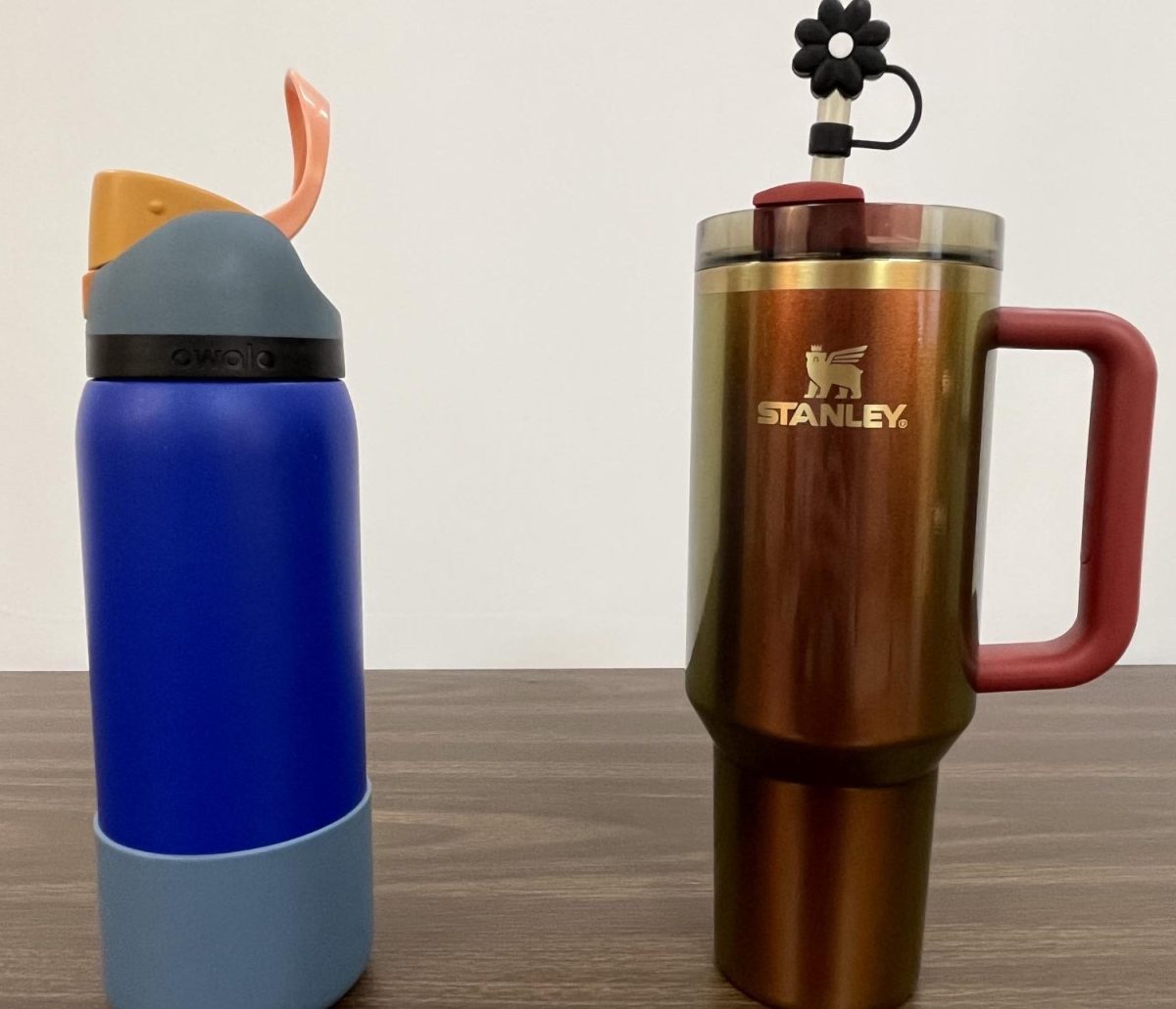 Accessories for days. This is the straw topper for the Stanley and the bottle boot for the Owala. “I like that I can have a water bottle that’s a fun color. I’d prefer a Yeti, but the bright orange is my favorite part,” Neve Guerrette ‘25 said. 
